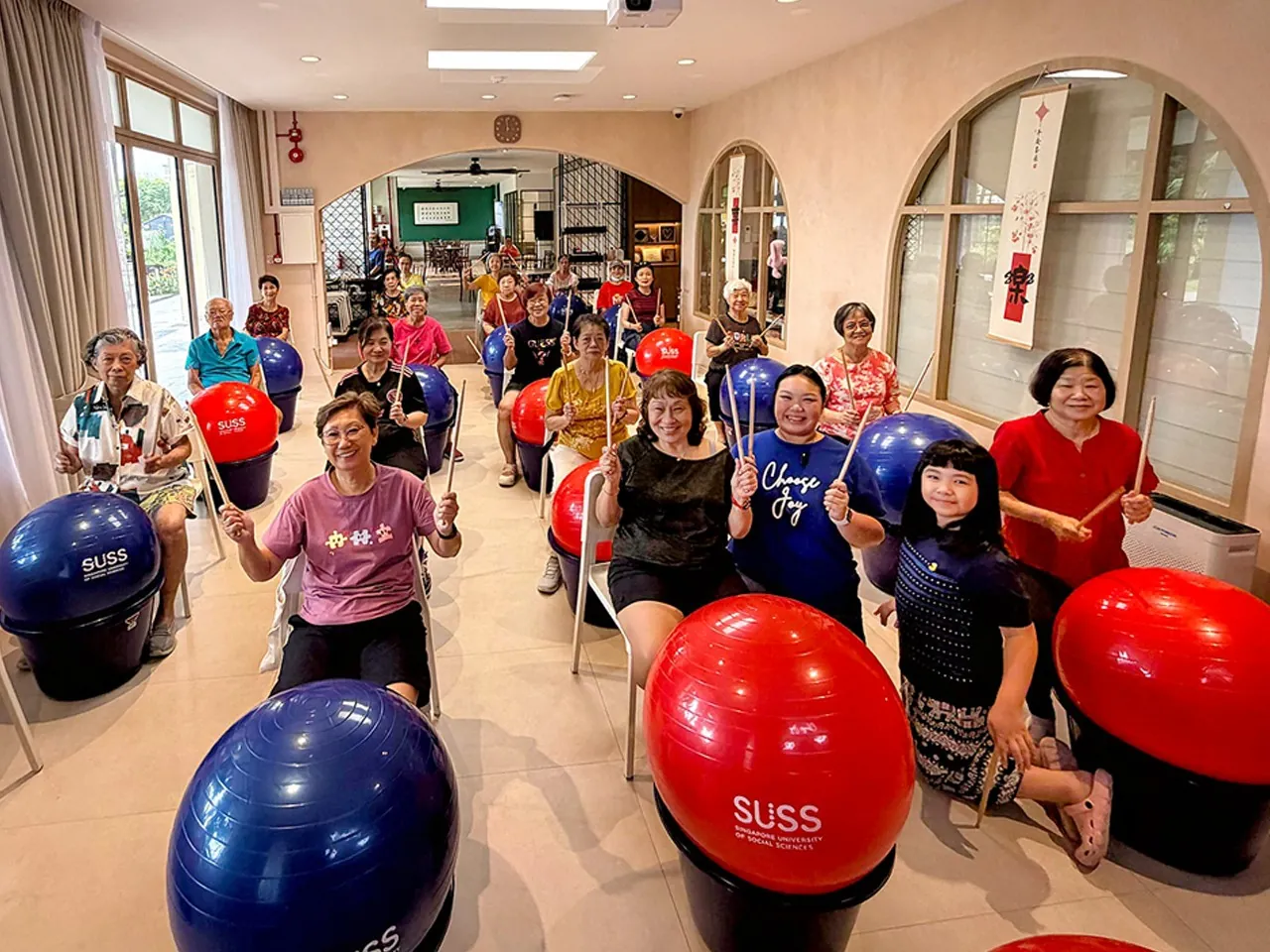 Seniors at House of Joy Mountbatten taking part in a cardio drumming exercise session